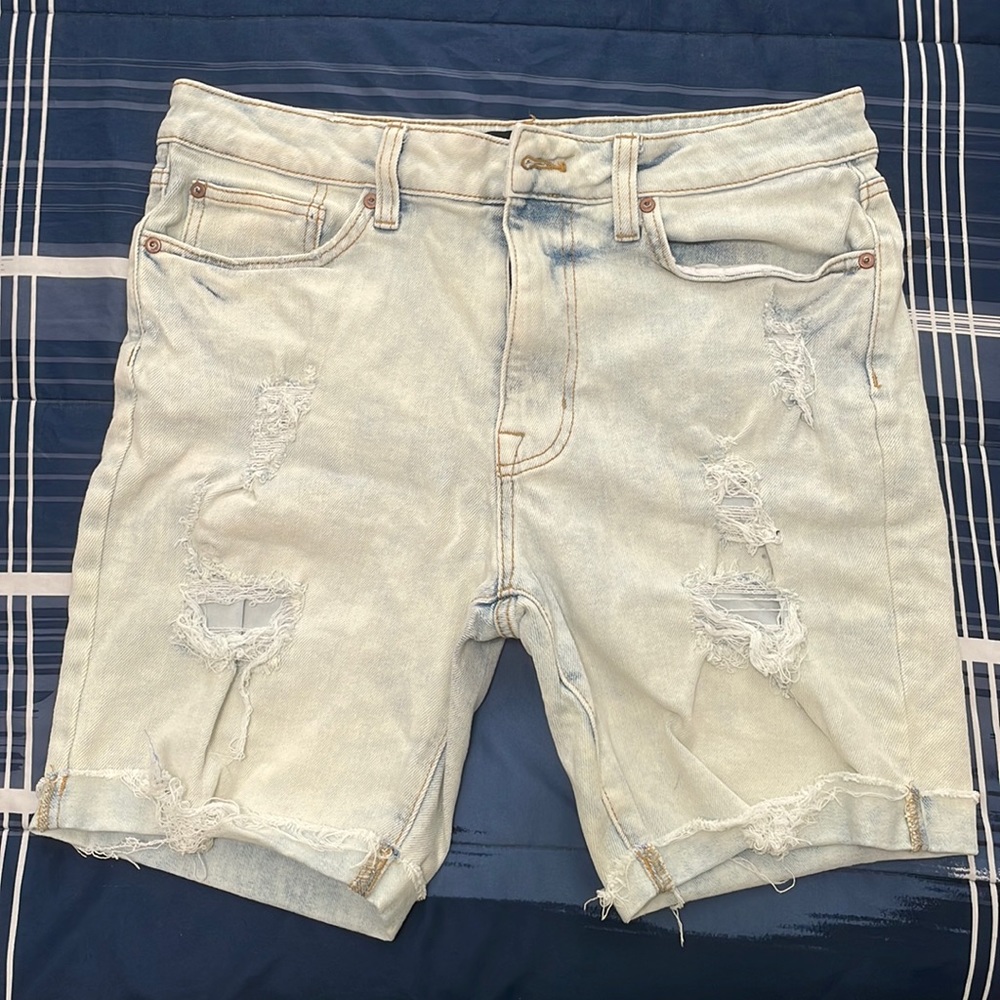 Light denim jean shorts for men.